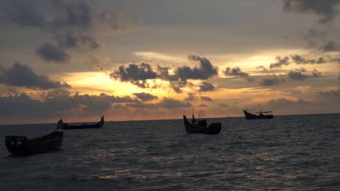 Fishing boats floating in the Sea, Marari beach, Alappuzha