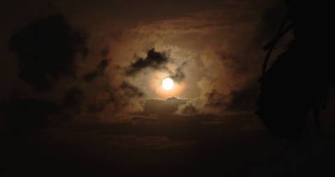 Radiant moon on a cloudy sky