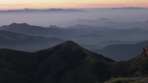 Layers of mountain ranges draped in morning mist