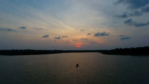 Moving aerial shot of river during sunset