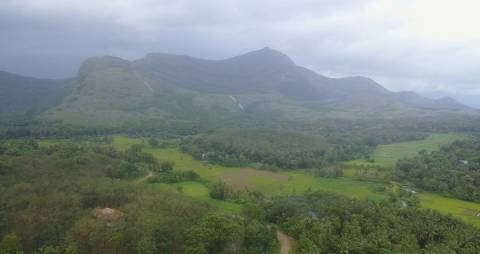 Aerial shot of green fields and hills in Kerala