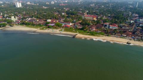 Aerial shot of beach and adjacent town