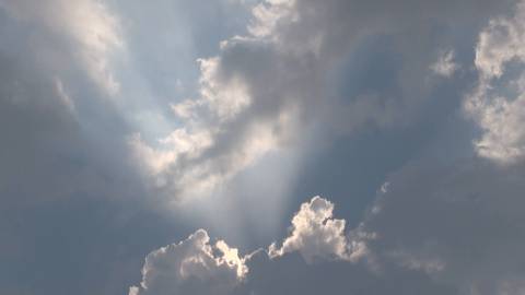 Transient clouds on a plain blue sky