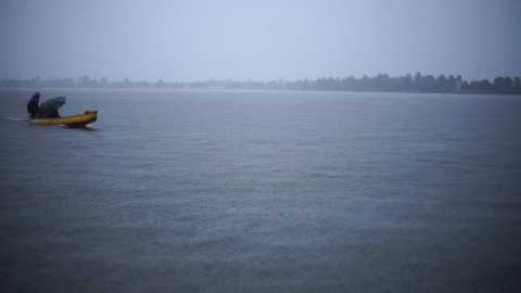 Slow motion shot of boat gliding through Alappuzha backwaters