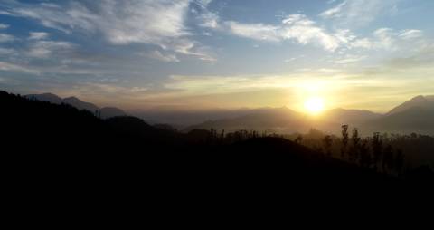 Sunrise in the hills in between mountains