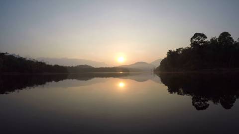 Sunrise on top of a lake, Kerala