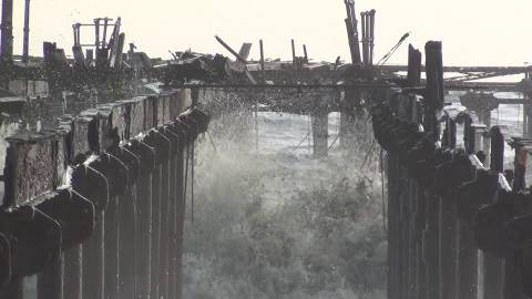 Waves hitting broken sea bridge